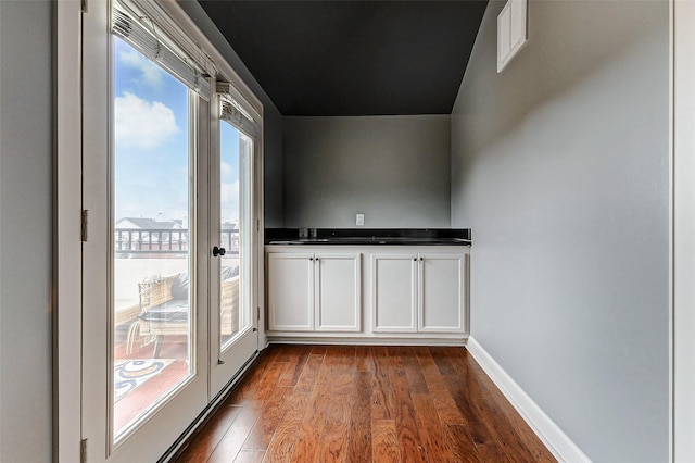 doorway featuring dark hardwood / wood-style floors