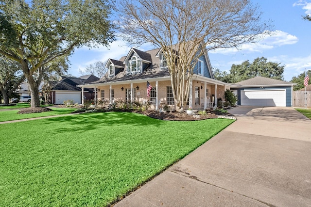 new england style home with a garage, covered porch, a front lawn, and brick siding