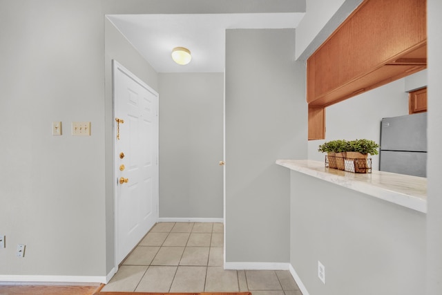 view of tiled foyer entrance