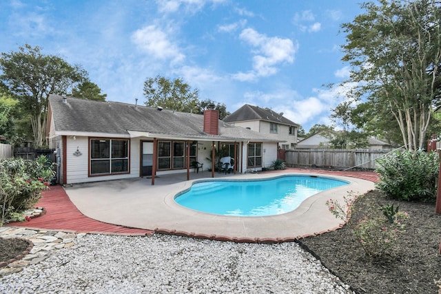 view of swimming pool with a patio, a fenced backyard, and a fenced in pool