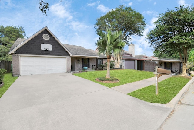 view of front of house with a front yard and a garage