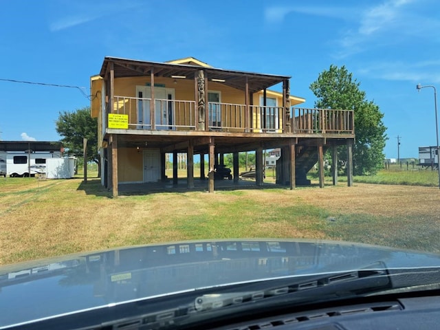 rear view of house with a lawn