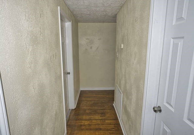 hall with dark wood-type flooring