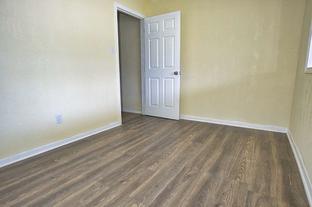 empty room featuring dark hardwood / wood-style floors