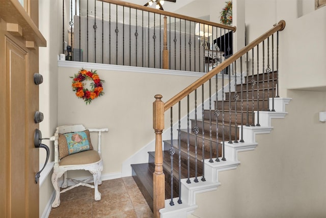 stairway featuring tile patterned floors