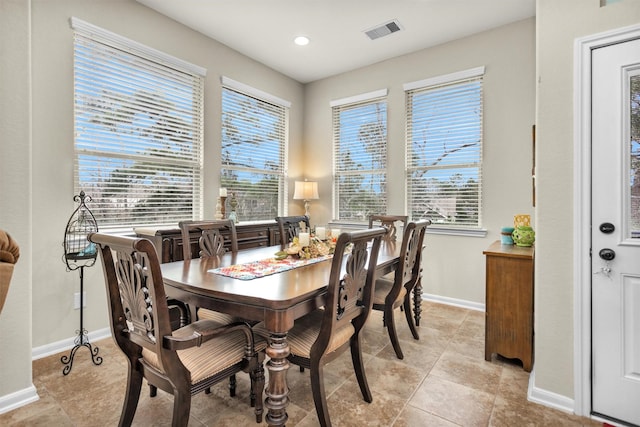 dining area featuring light tile patterned flooring