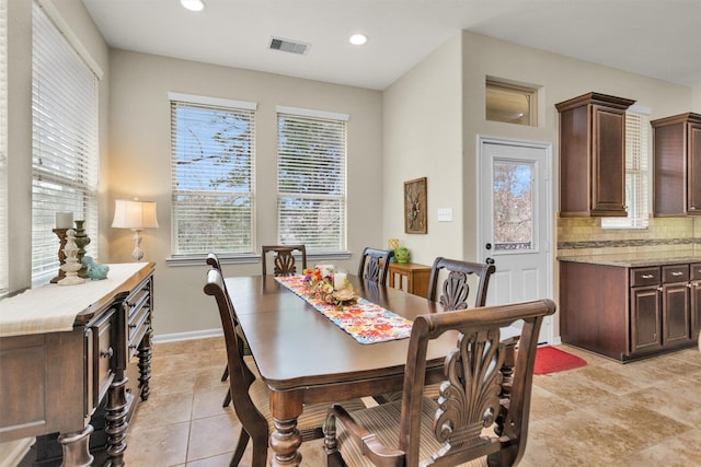 dining space featuring light tile patterned floors