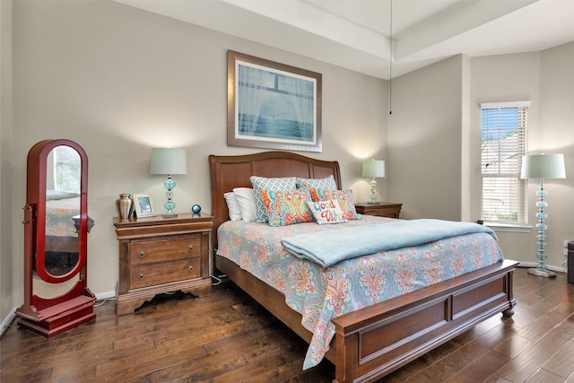 bedroom with dark wood-type flooring