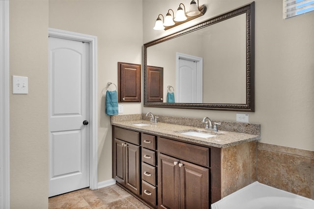 bathroom featuring vanity and a bathing tub