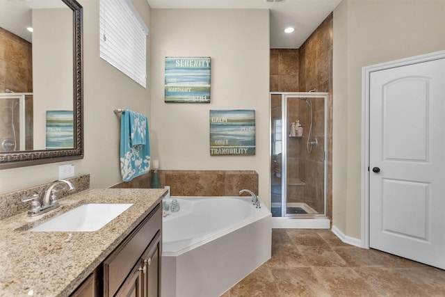 bathroom with separate shower and tub and vanity