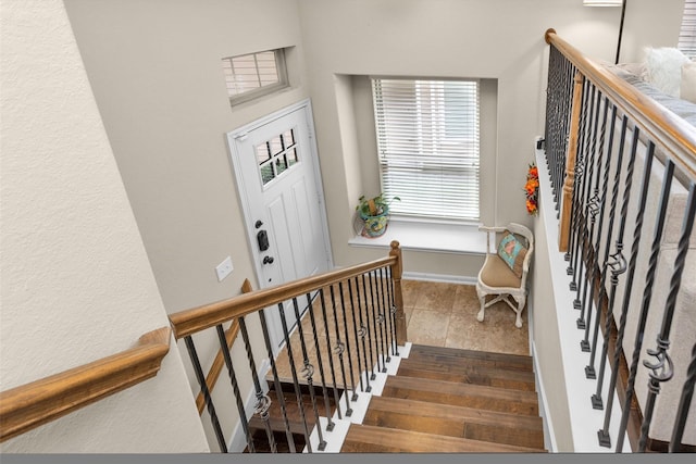 stairs featuring tile patterned flooring