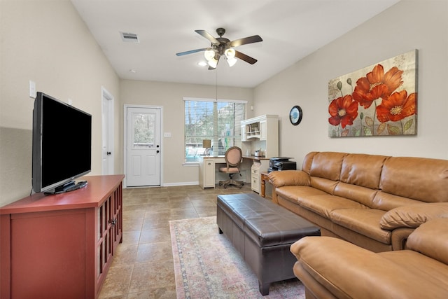 tiled living room with ceiling fan