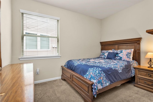 bedroom with light colored carpet