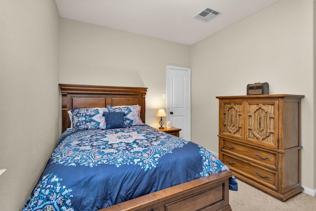 bedroom with light colored carpet