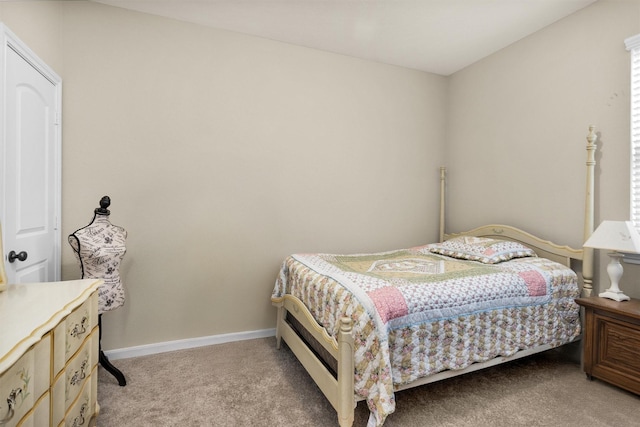 bedroom featuring light colored carpet