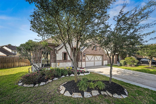 view of front of home featuring brick siding, fence, driveway, stone siding, and a front yard