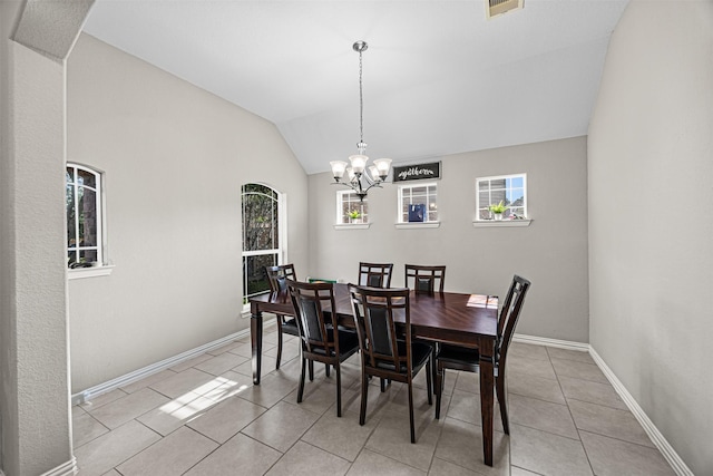 dining room with light tile patterned floors, visible vents, baseboards, vaulted ceiling, and a notable chandelier