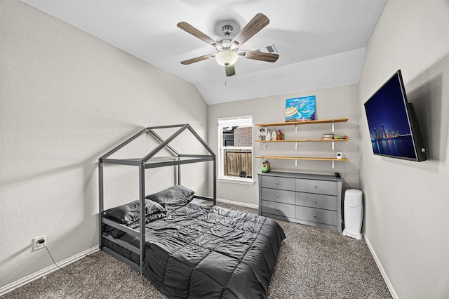 bedroom with vaulted ceiling, dark carpet, a ceiling fan, and baseboards