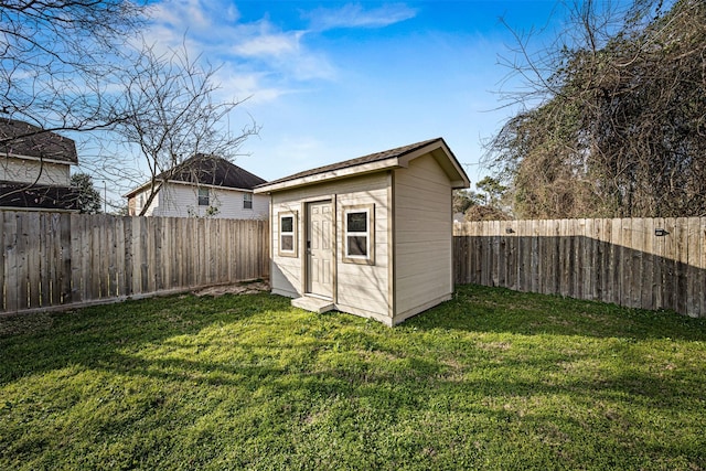 view of shed with a fenced backyard