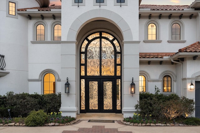 property entrance featuring french doors