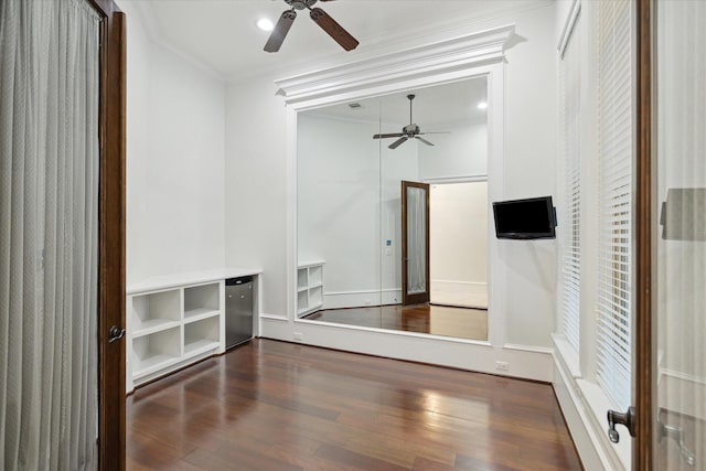 interior space featuring ceiling fan, fridge, crown molding, and dark hardwood / wood-style floors