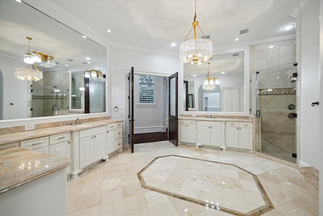 bathroom featuring ornamental molding, vanity, an enclosed shower, and a notable chandelier