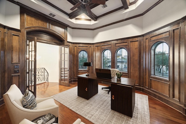 home office with coffered ceiling, crown molding, dark wood-type flooring, and ceiling fan