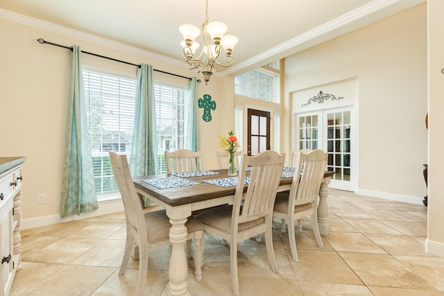 dining area with an inviting chandelier, light tile patterned floors, and crown molding