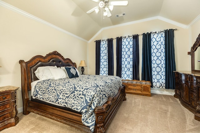 carpeted bedroom featuring ceiling fan, vaulted ceiling, and crown molding