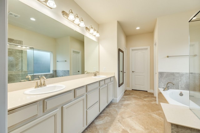 bathroom with a bathing tub and vanity