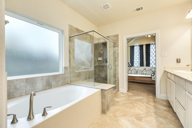 bathroom featuring separate shower and tub and vanity