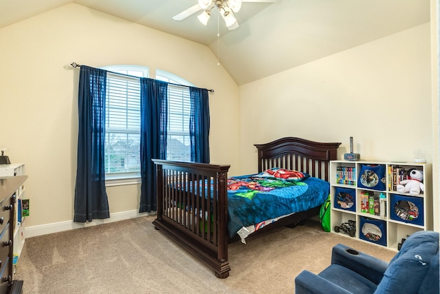 bedroom featuring lofted ceiling, ceiling fan, and light colored carpet