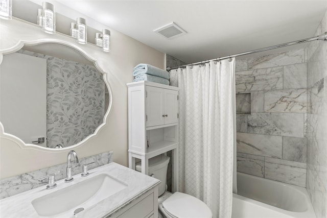 bathroom with shower / tub combo, visible vents, vanity, and toilet