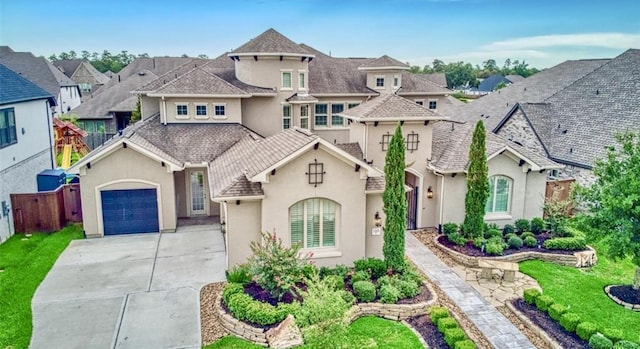 view of front of house featuring driveway, a residential view, fence, and stucco siding