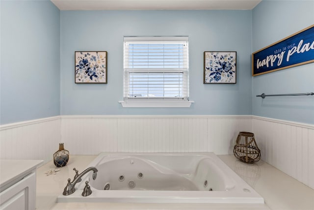 bathroom featuring a tub to relax in