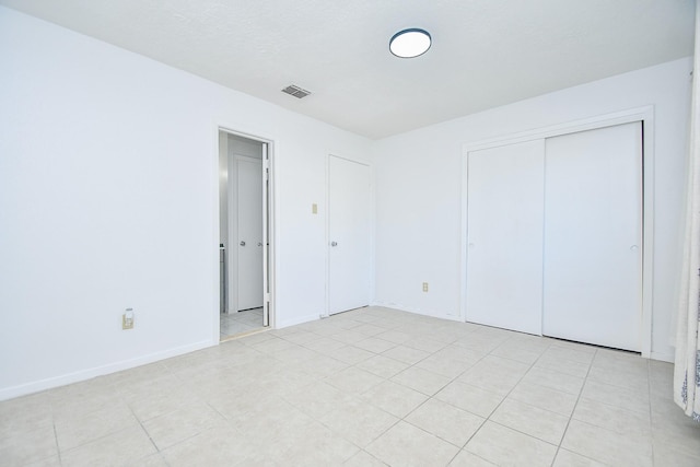 unfurnished bedroom with a closet