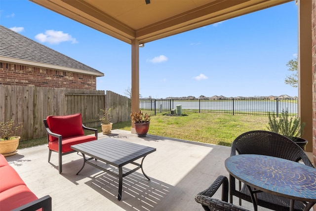 view of patio / terrace featuring a water view