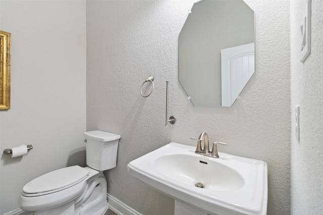 bathroom with sink and toilet