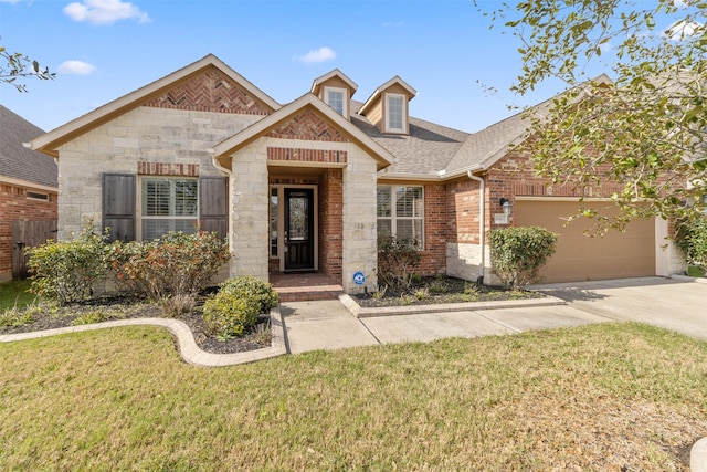 view of front of property featuring a front lawn and a garage