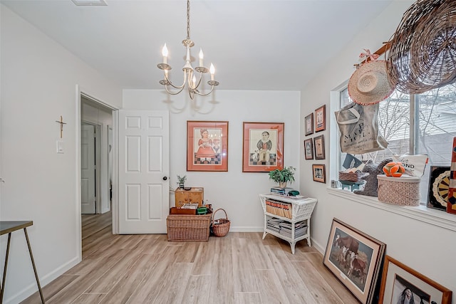 dining room featuring a notable chandelier and light hardwood / wood-style floors