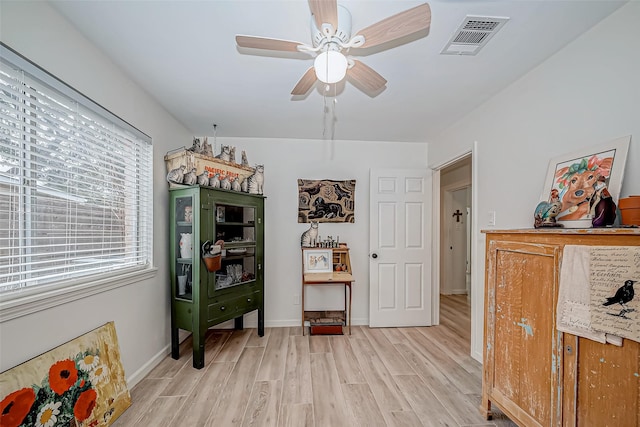 interior space featuring light wood-type flooring and ceiling fan