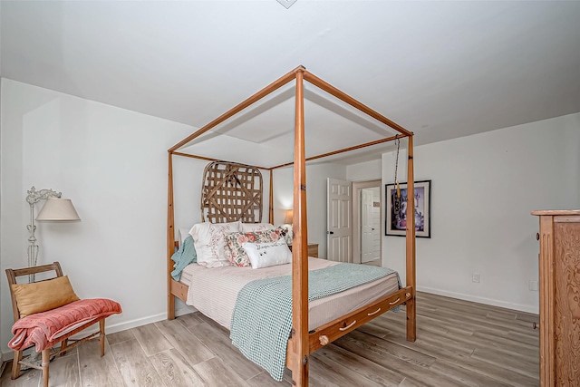 bedroom with hardwood / wood-style floors