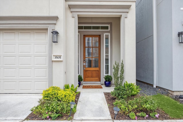 view of exterior entry featuring stucco siding