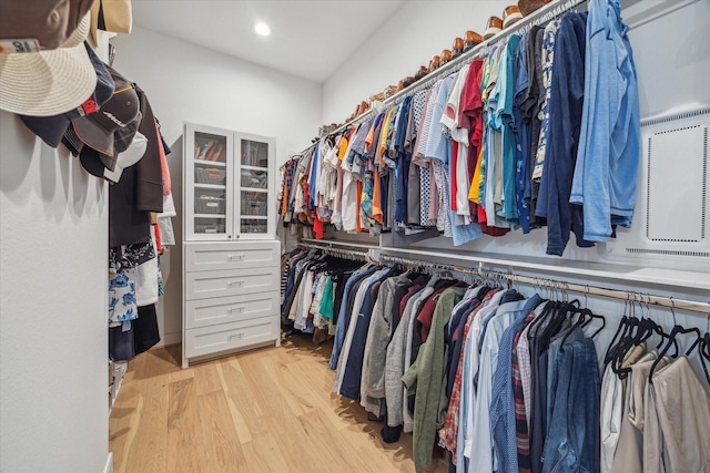 spacious closet featuring light wood-style floors