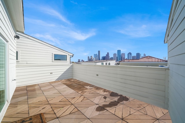 view of patio / terrace featuring a city view and a balcony