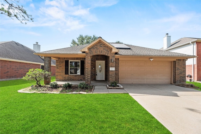 ranch-style house with a front lawn, a garage, covered porch, and solar panels