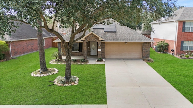 view of front of home with a front lawn and a garage