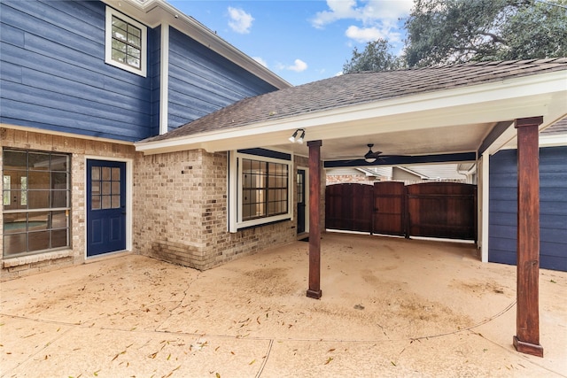 view of exterior entry with ceiling fan