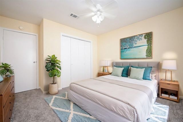 carpeted bedroom with a closet and ceiling fan