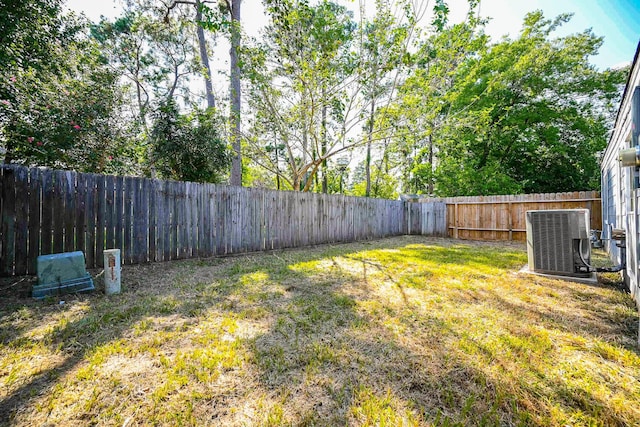 view of yard featuring central AC